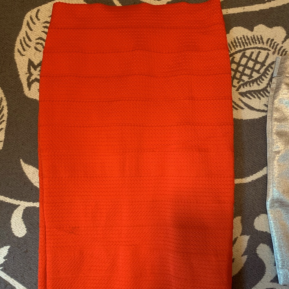 Midi length red skirt
